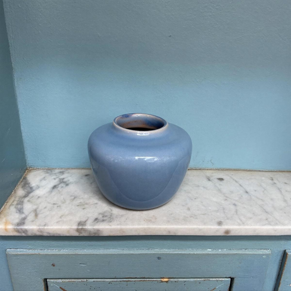 A small glazed bud vase.