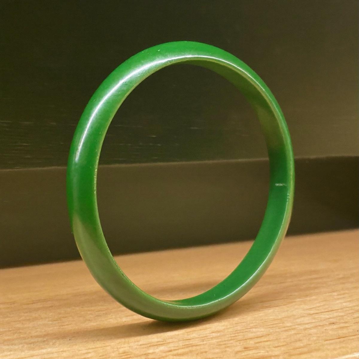 A solid colored enamel bangle.