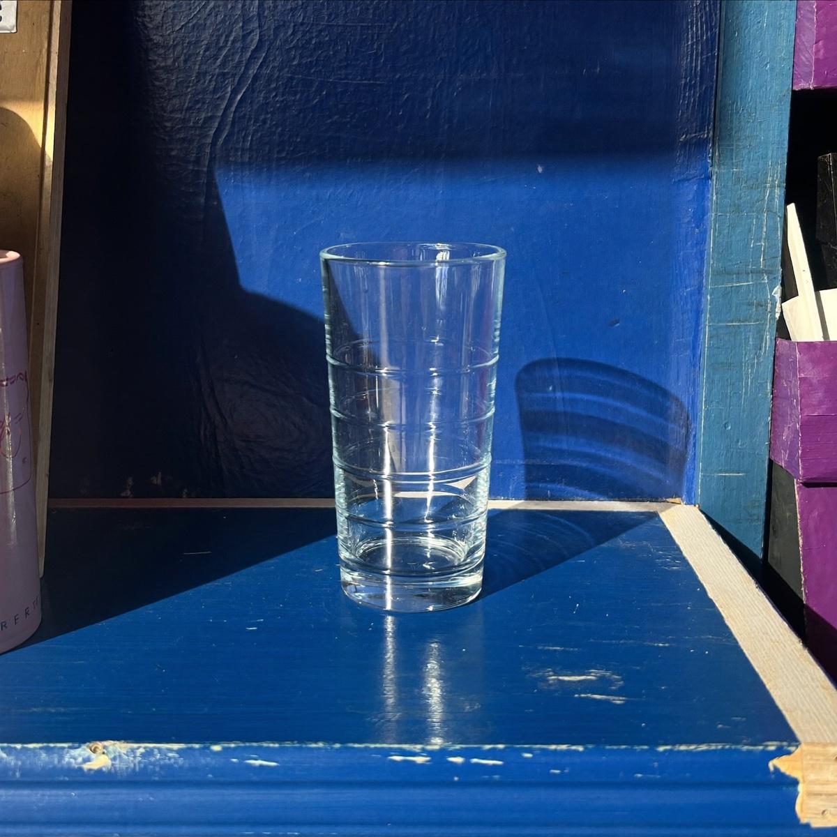 A single ribbed glass tumbler.