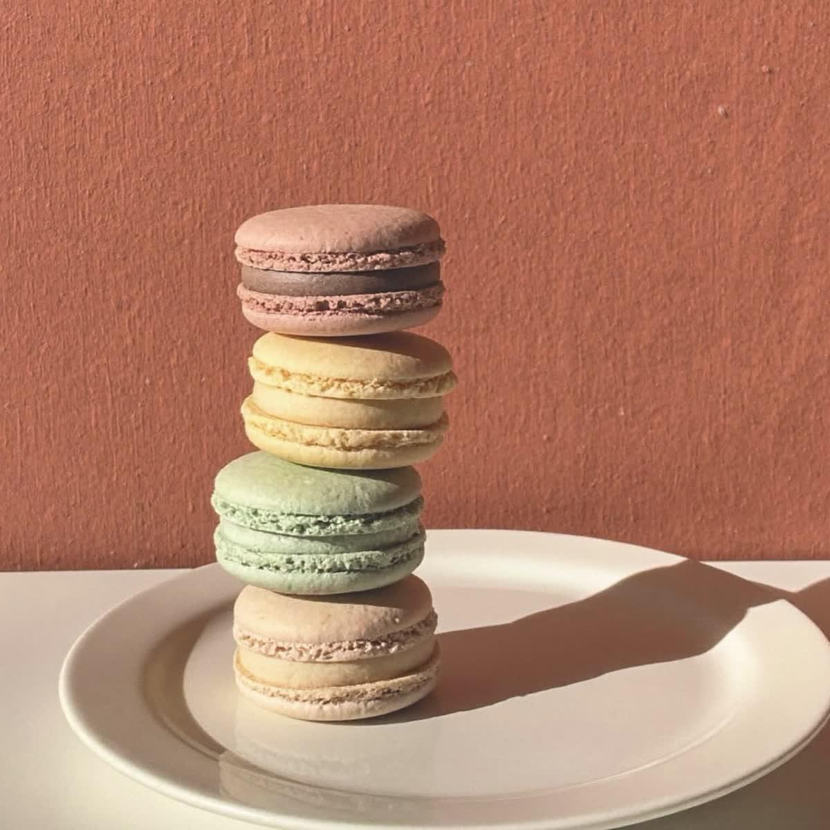 A short stack of pastel macarons.